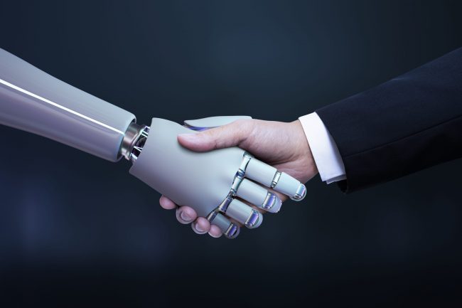Business hand robot handshake, artificial intelligence digital t Business hand robot handshake, artificial intelligence digital